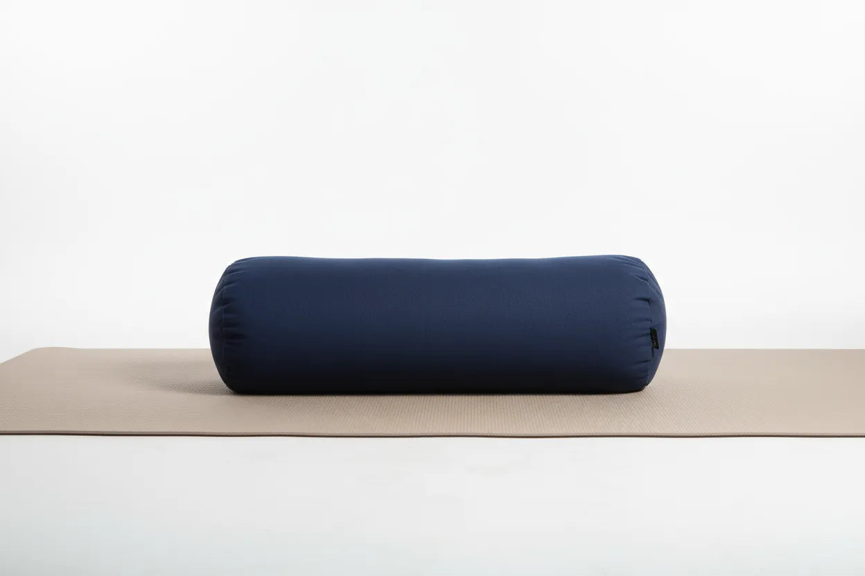 navy blue standard bolster on a yoga mat